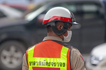 Bangkok, Thailand - September 17 2018: Police officer doing the traffic near Chit Lom BTS station.
