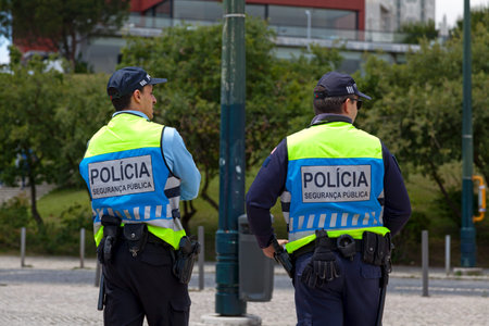 Lisbon, Portugal - June 01 2018: Two police officers of the PolÃ­cia de SeguranÃ§a PÃºblica in...