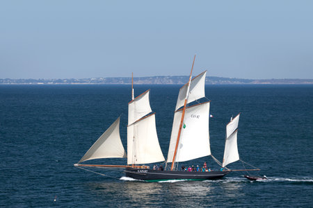 Douarnenez, France - July 17 2022: La Cancalaise is a bisquine replica built in 1987 in Cancale. She is rigged as a three-masted fishing lugger with full sails.のeditorial素材
