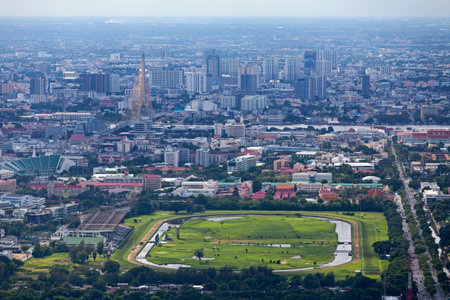 Bangkok, Thailand - September 17 2018: Aerial view of the Royal Turf Club of Thailand with behind, the United Nations Conference Centre, the Government House of Thailand and the Rama VIII Bridge crossing the Chao Phraya.のeditorial素材