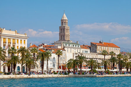 Split, Croatia - April 16 2019: Bell tower of Saint Domnius Cathedral by the sea with the Mosor mountains behind.のeditorial素材