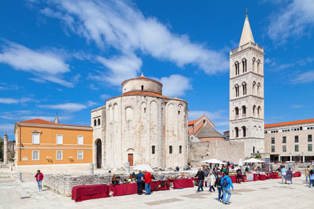 Zadar, Croatia - April 14 2019: The Church of St Donatus between the bell tower of the Zadar Cathedral and the Stup srama (Pillar of shame).のeditorial素材