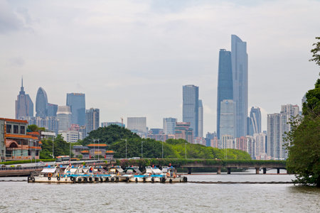Guangzhou, China - August 15 2018: Bridge crossing the Zhughiang river with behind the skyscrapers of the Guangzhou's central business district.のeditorial素材