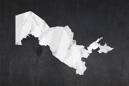 Blackboard with a the map of Uzbekistan drawn in the middle.の写真素材