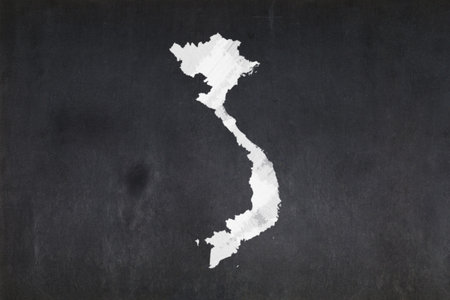 Blackboard with a the map of Vietnam drawn in the middle.の写真素材