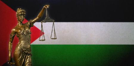 Close-up of a small bronze statuette of Lady Justice.の写真素材