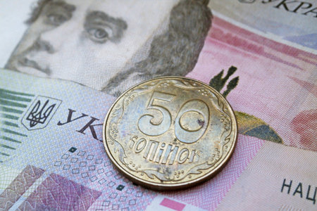 Ukrainian hryvnia coin and banknotes as background.の写真素材