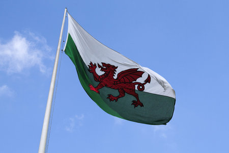 Flag of Wales waving atop of its pole.