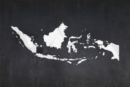 Blackboard with a the map of Indonesia drawn in the middle.の写真素材