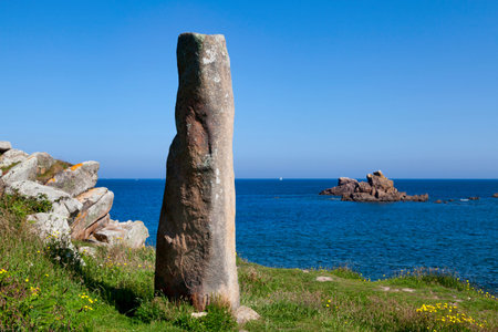 The Menhir des Marsouins is a standing stone on the edge of the Pointe de Primel in Plougasnou, Brittany.の写真素材