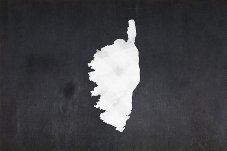 Blackboard with a the map of Corsica drawn in the middle.の写真素材