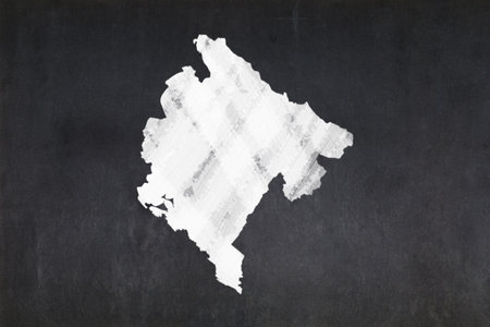 Blackboard with a the map of Montenegro drawn in the middle.の写真素材