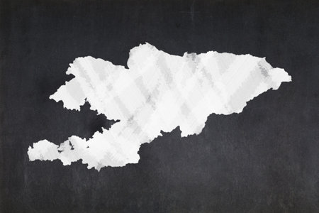 Blackboard with a the map of Kyrgyzstan drawn in the middle.の写真素材