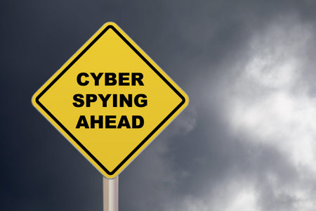 Diamond-shaped crossing sign with yellow background and black border with Cyber spying ahead written...