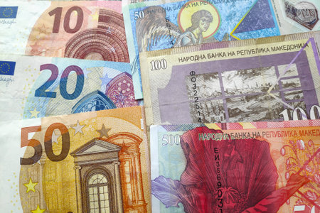 Close-up on a stack of Euros and Macedonian denar.の写真素材