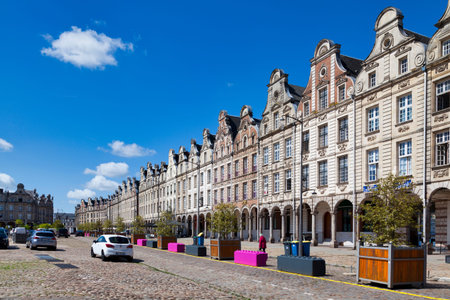 Arras, France - June 22 2020: Flamboyant Gothic buildings with Flemish gables and arcades along the...