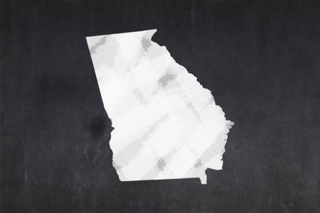 Blackboard with a the map of the State of Georgia (USA) drawn in the middle.の写真素材