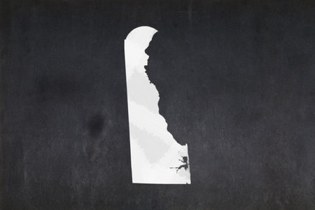 Blackboard with a the map of the State of Delaware (USA) drawn in the middle.の写真素材