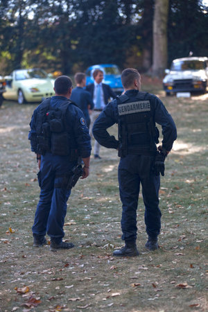 Chantilly, France - September 3 2016: Two gendarmes on patrol during the weekend equipped with...