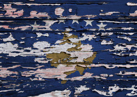 Flag of Kosovo painted on a grunge wooden board.の写真素材