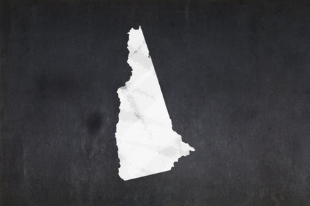 Blackboard with a the map of the State of New Hampshire (USA) drawn in the middle.の写真素材