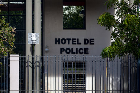 Facade of the HÃ´tel de Police (Police station) of Saint-Pierre de la Reunion with a CCTV camera at the entrance. In France, HÃ´tel de police is the most important type of police station in term of size, services and responsabilities.の写真素材