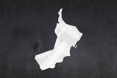Blackboard with a the map of Oman drawn in the middle.の写真素材
