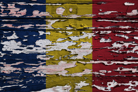 Flag of Romania painted on a grunge wooden board.の写真素材