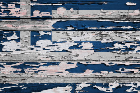 Flag of Greece painted on a grunge wooden board.の写真素材