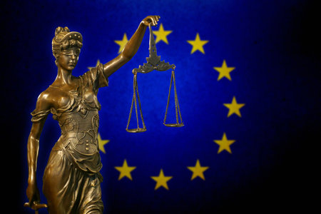 Close-up of a small bronze statuette of Lady Justice.の写真素材