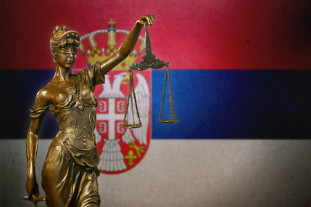 Close-up of a small bronze statuette of Lady Justice.の写真素材