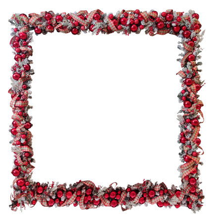 Christmas frame with red balls, pine twigs with fake snow, ribbon and pine cones on white background.の写真素材