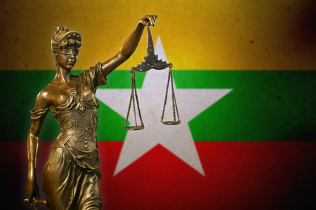 Close-up of a small bronze statuette of Lady Justice.の写真素材