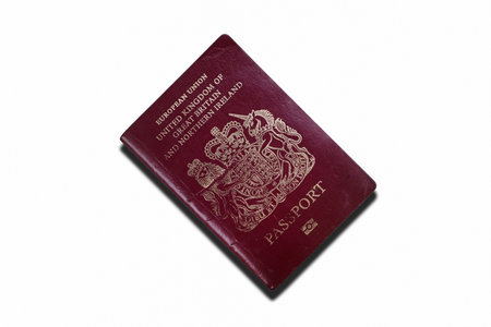 Close-up on a British passport isolated on a white background.の写真素材