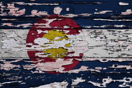 Flag of Colorado painted on a grunge wooden board.の写真素材