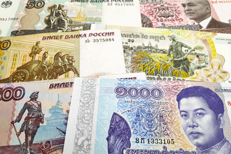 Close-up on a stack of Russian Rubles and Cambodian Riel.