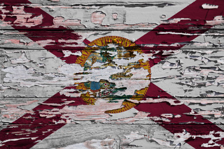 Flag of Florida painted on a grunge wooden board.の写真素材