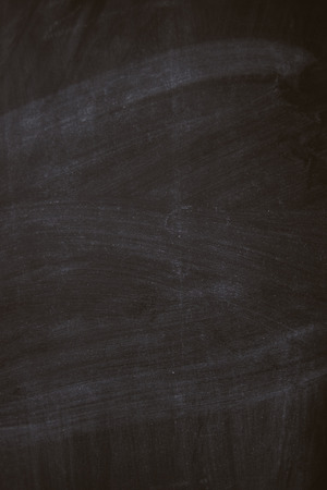 Black chalk board texture background with chalk rubbed outの写真素材