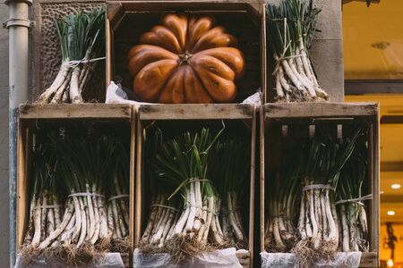Healthy natural vegetables in wooden rustic boxes on marketの写真素材