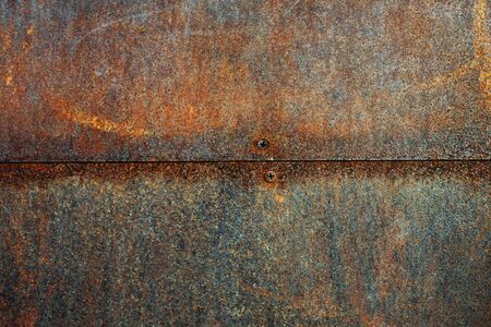 Texture of metal rusty wall with screws, close up viewの写真素材