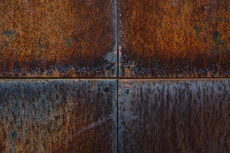 Texture of metal rusty wall with screws, close up viewの写真素材