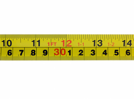 Photo of the one foot mark, twelve inches, on a tape measurer, isolated on white