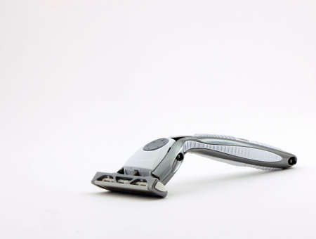 Photo of a razor shot on a white backgroundの写真素材