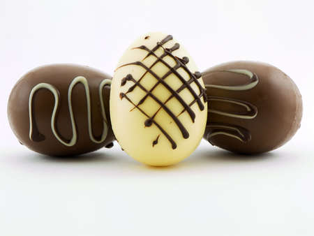 Photo of three gourmet chocolate easter eggs shot on a white backgroundの写真素材