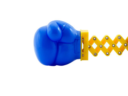 Photo of a boxing glove on a retractable arm, isolated on whiteの写真素材