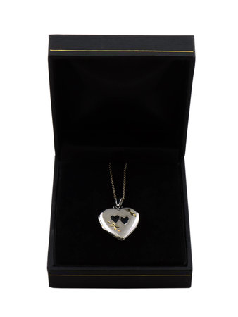 Photo of a locket necklace in a jewelry box isolated on whiteの写真素材