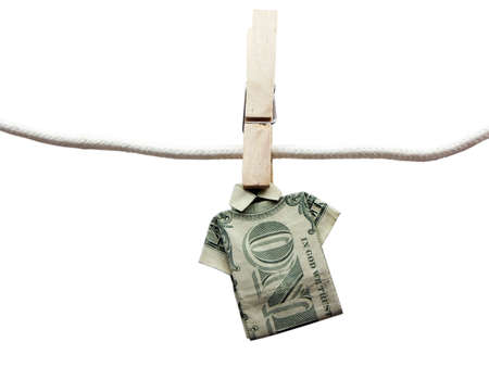 Photo of a tshirt made from a folded dollar bill on a clothes line isolated on whiteの写真素材