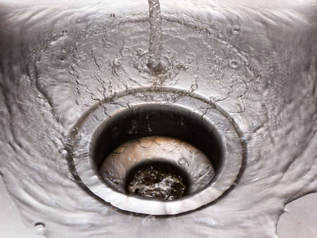 Water pouring into a sinkの写真素材