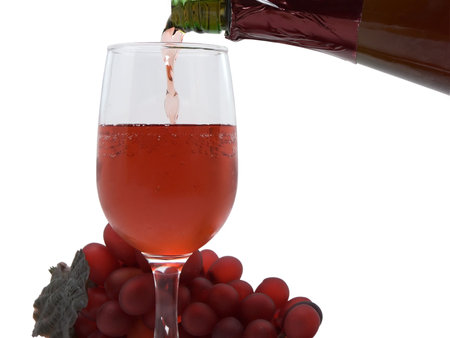 Photo of wine being poured, isolated on white
