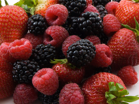Photo of a pile of strawberries,raspberries,and blackberries